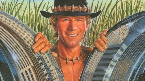 Cropped section of poster from Crocodile Dundee showing Paul Hogan smiling