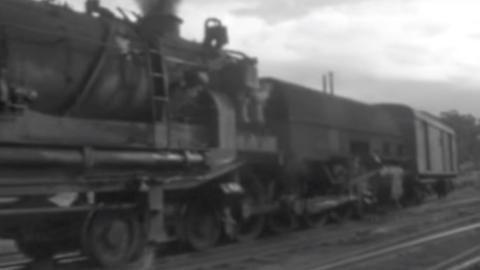 Screenshot of amateur black and white footage showing train passing in Newcastle, circa 1970s. 