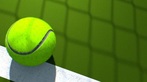 Close up of a tennis ball on a tennis court.