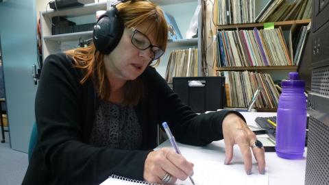 Karen Hewitt at her desk working at the NFSA