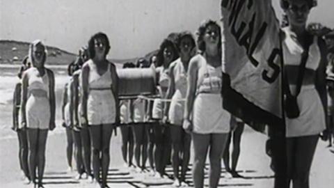 Female lifesavers from Terrigal Surf Life Saving Club participate in a march past
