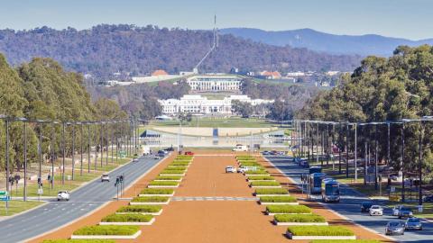 The old and new Parliament houses in Canberra seen down Anzac Avenue