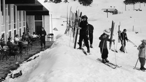 Skiers outside a ski lodge in 1961