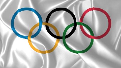 The Olympic rings on a silver satin cloth