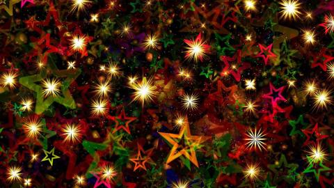 Stars and Christmas lights cover a red background.